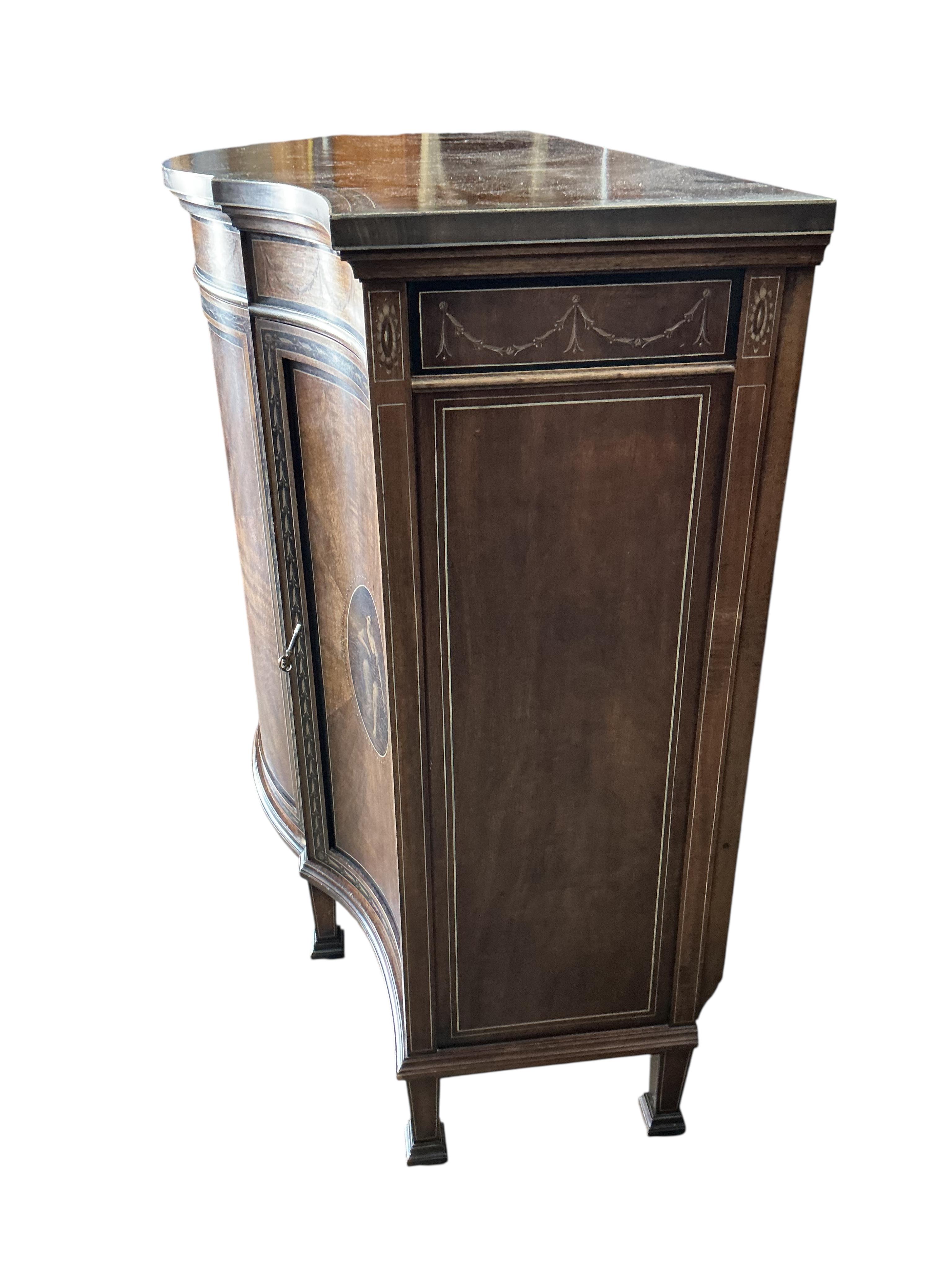 An Edwardian Sheraton Revival painted mahogany bowfront side cabinet
